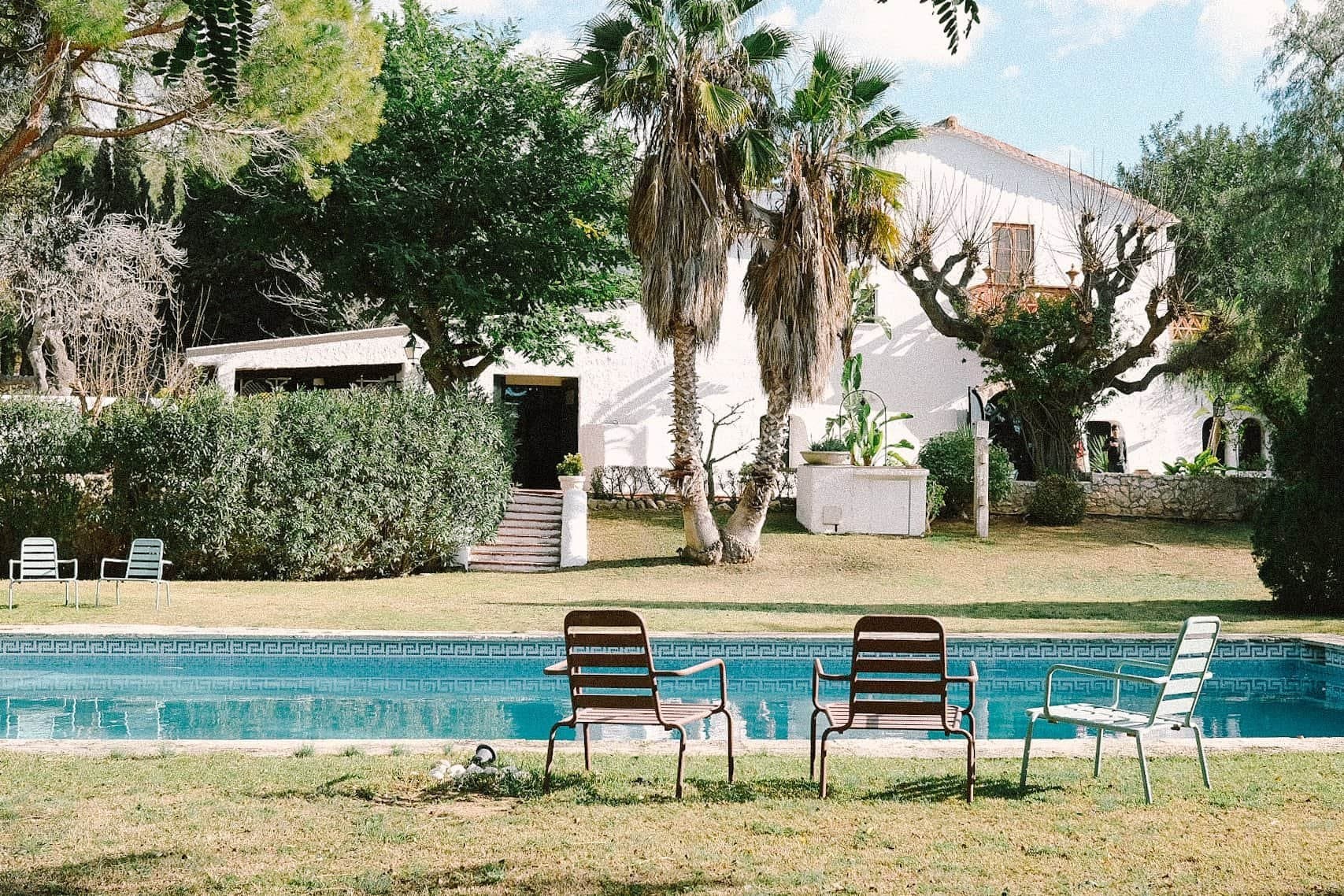 The swimming pool and garden at Masia Can Pares in summer, near Sitges